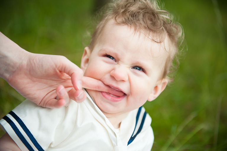 baby biting finger